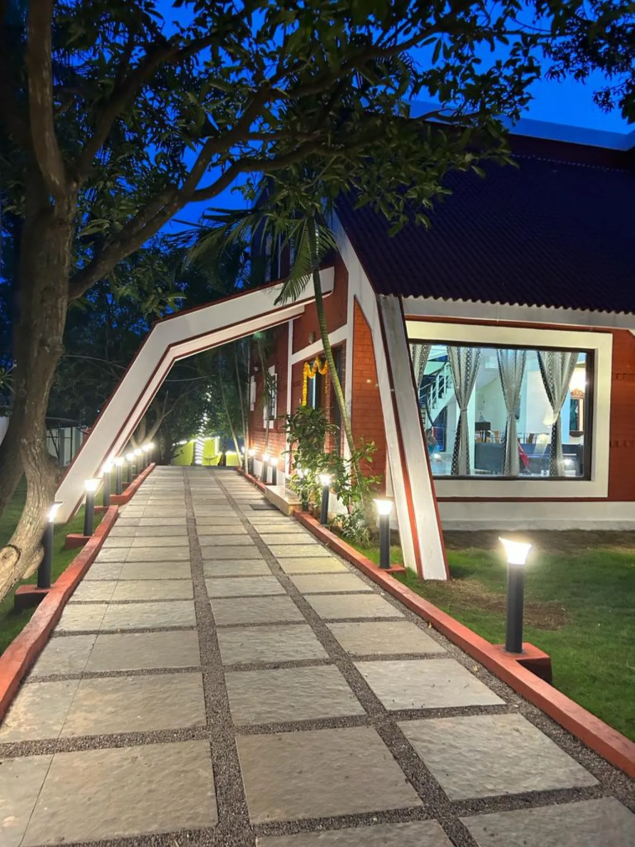 The farmhouse at night at Moon Farm Stay, Kanakamamidi, Moinabad