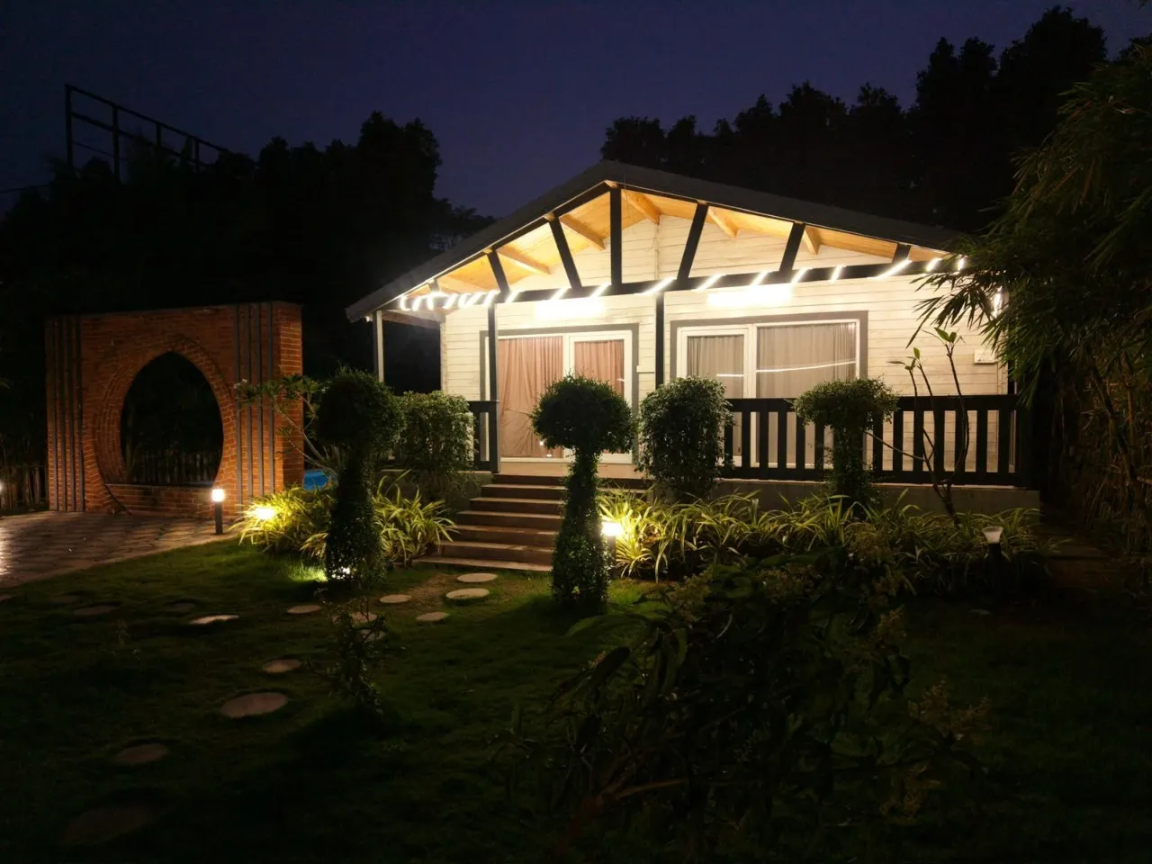 The farmhouse at night at wooden escape, Tolkatta, Moinabad