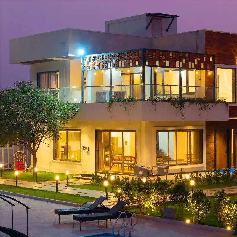 The farmhouse at night at Silver Meadows, Moinabad