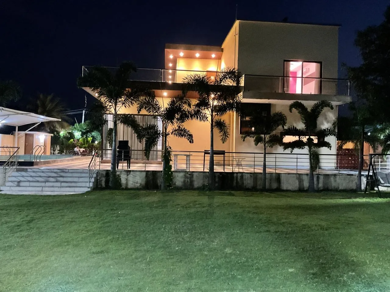 The farmhouse at night at Charan's Villa, Moinabad